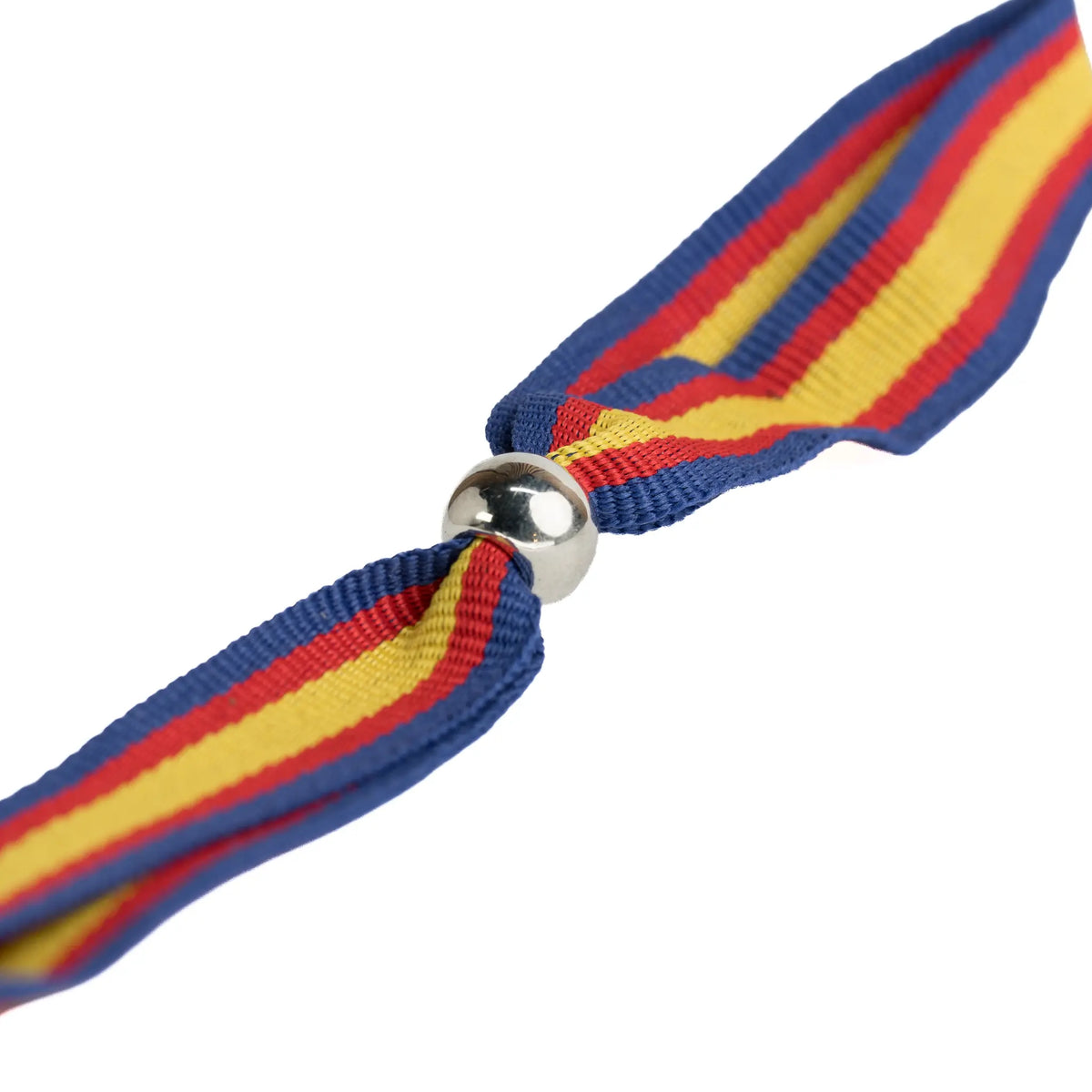 Comprar Pulsera de tela bandera de España con perfil azul con bola plateada · 1,5 cm La Flamenca de Borgoña Bandera España