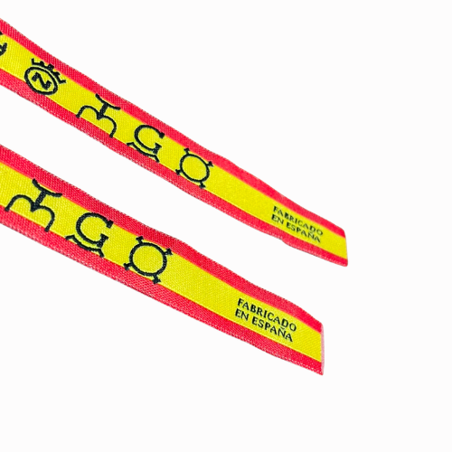 Pulsera de tela con hierros taurinos y bandera de España